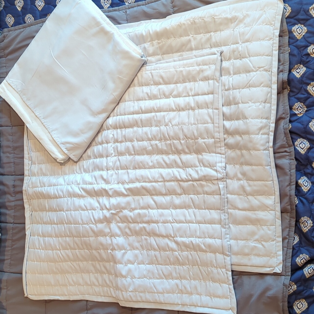 Two euro pillow covers with matching bed skirt